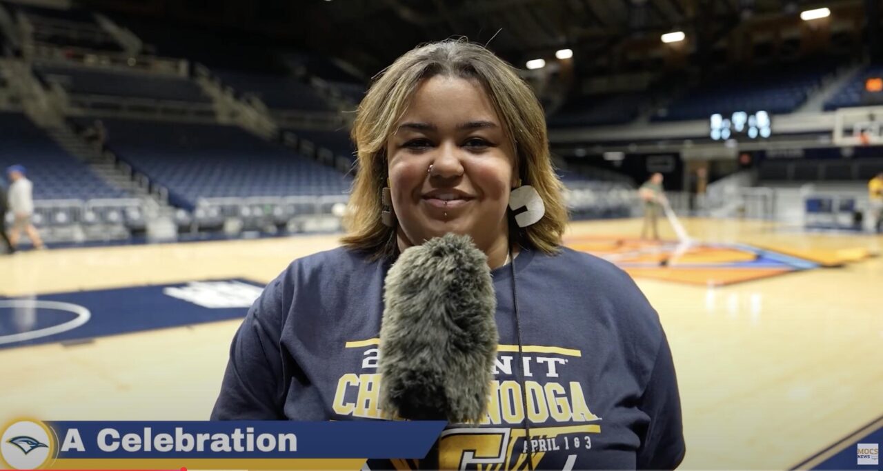 Mallori Crocker reports from the NIT court. Click to watch broadcast. Photo courtesy of Mocs News.
